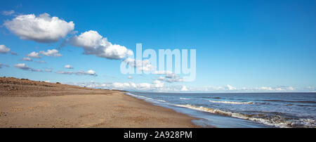 Clouds in a Blue Sky over the Coast Stock Photo