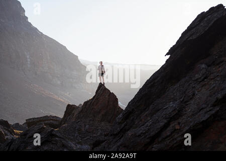 Boy on top of mountain Stock Photo