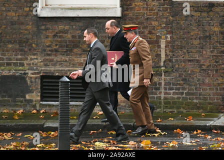 Defence Secretary Ben Wallace (centre) arriving at 10 Downing Street, London, to attend a meeting, chaired by Prime Minister Boris Johnson of the Government's emergency committee Cobra to discuss the response to recent flooding in the North of England. Stock Photo