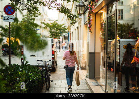 Woman walking on street Stock Photo