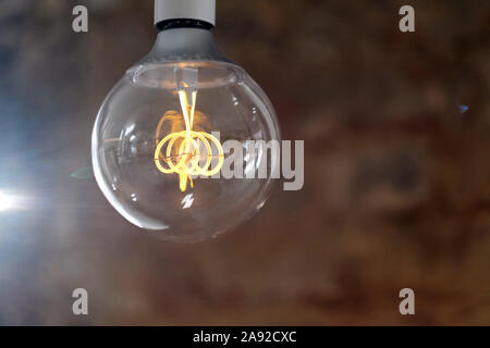 Modern LED lamp with a ball-shaped glass bulb design in retro style Stock Photo