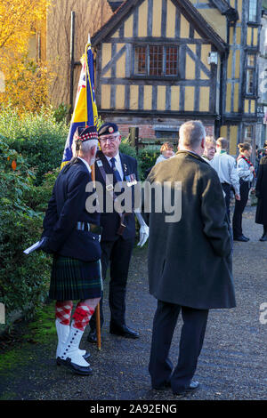 Remembrance Sunday commemorations on a beautiful Sunday at Shrewsbury Castle in Shropshire. Retired soldiers exchange stories. Stock Photo