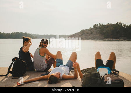 Friends relaxing at sea Stock Photo