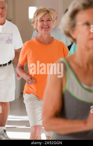 Seniors exercising in a health club Stock Photo