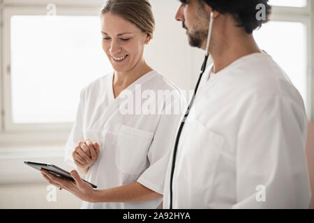 Doctors using digital tablet Stock Photo