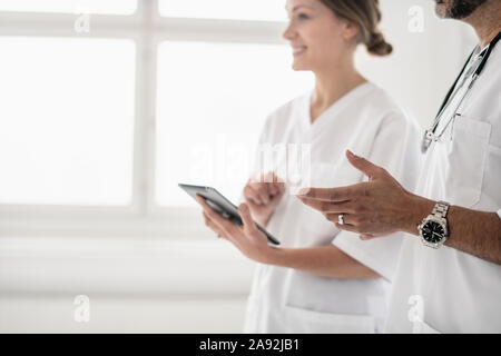Doctors using digital tablet Stock Photo
