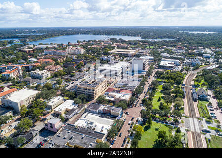 Winter Park Florida,Orlando,North South Park Avenue,Central Park,Amtrak Sunrail Train Station,city skyline,Lake Virginia aerial,FL191109d09 Stock Photo