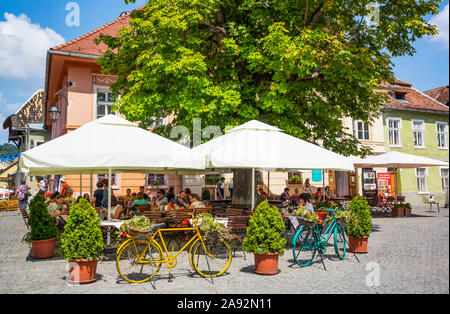 Outdoor restaurant; Sighisoara, Mures County, Transylvania Region, Romania Stock Photo