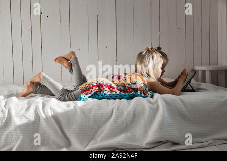 Girls using digital tablet Stock Photo