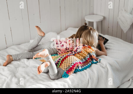 Girls using digital tablet Stock Photo