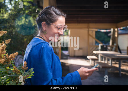 Young woman using smartphone Stock Photo