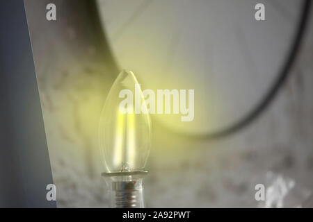 shinny light bulb in front the watch circle Stock Photo