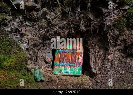 A fairy door in a woodland area. Stock Photo