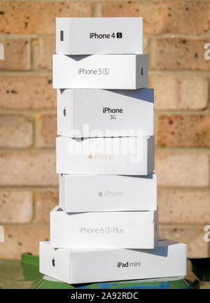Stack of empty Apple iPhone and iPad packaging boxes ready for recycling, Apple was founded in 1976. Stock Photo