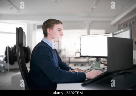Young man working in office Stock Photo