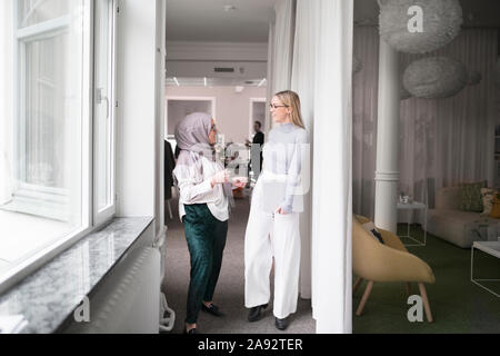 Two women working in office Stock Photo