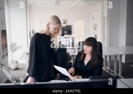 Two women working in office Stock Photo