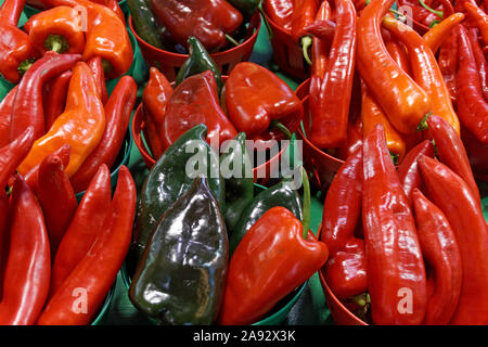 Closeup of green poblano peppers and red chili peppers for sale at the Jean Talon Market, Montreal, Quebec, Canada Stock Photo