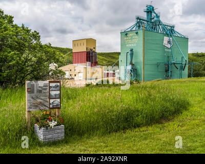 Grain elevator and sign for historical information in Rosebud, a hamlet in Southern Alberta, within Wheatland County; Alberta, Canada Stock Photo