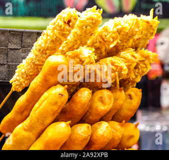 assortment of crispy deep fried coconut battered meats or various types at the Barcelona street food market Stock Photo