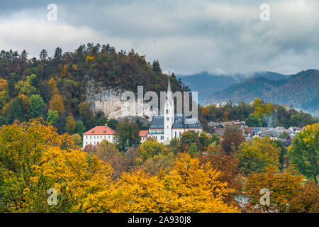 The St. Martina Parish Church with fall foliage color in Bled, Slovenia, Europe. Stock Photo