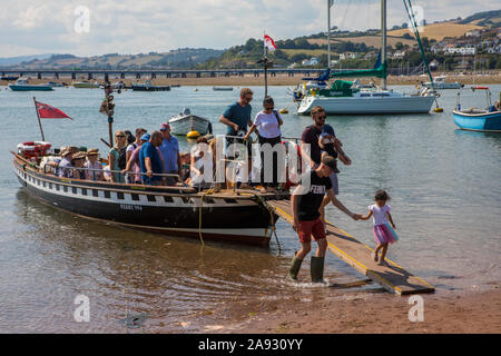 Devon, UK - August 1st 2019: Passengers getting off of the Teignmouth and Shaldon ferry.  It is the oldest passenger ferry in England. Stock Photo