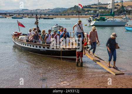 Devon, UK - August 1st 2019: Passengers getting off of the Teignmouth and Shaldon ferry.  It is the oldest passenger ferry in England. Stock Photo