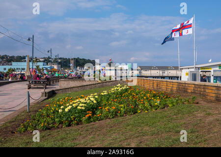 Devon, UK - August 1st 2019: A view of the promenade in the seaside town of Teignmouth in Devon, UK. Stock Photo