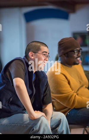 Black man with ADHD and Asian man with Autism in a meeting Stock Photo