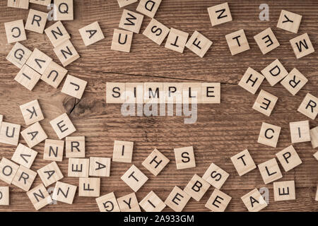 the word simple written with wooden letters on table Stock Photo