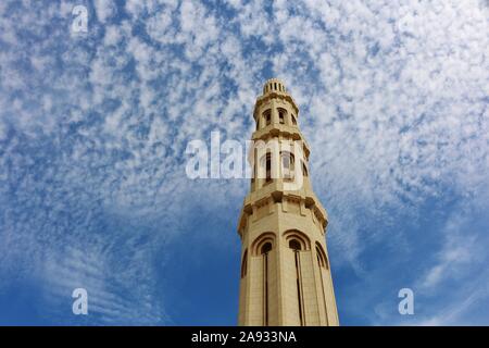 Sultan Qaboos Grand Mosque one of the high tower of the wall sourrounding the mosque Stock Photo