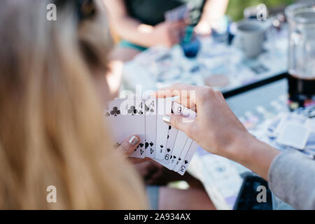 Woman playing cards Stock Photo