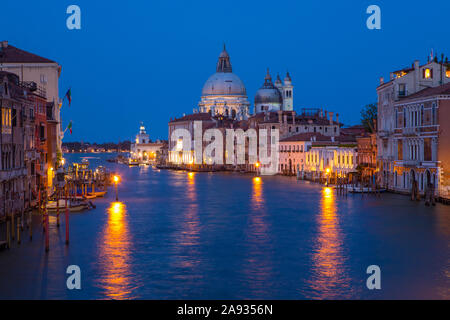 The stunning view from Ponte dell'Accademia taking in the sights of the Grand Canal and Basilica di Santa Maria della Salute in the beautiful city of Stock Photo