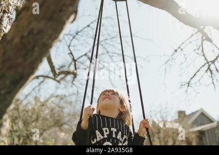 Girl on swing Stock Photo