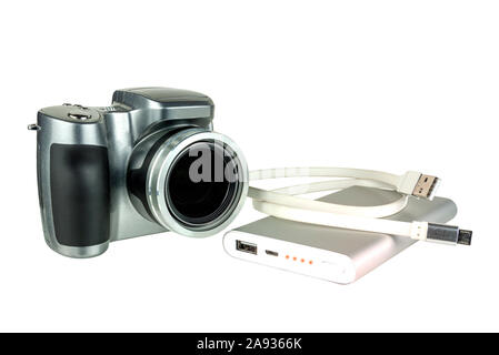 Power Bank with a wire and a camera on a white background. Stock Photo