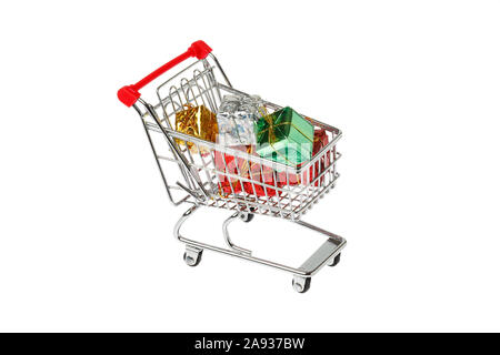 One shopping cart filled with gift boxes isolated on white background. Stock Photo
