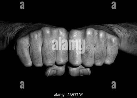 Man's clenched fists side by side, close up. black and white. Stock Photo