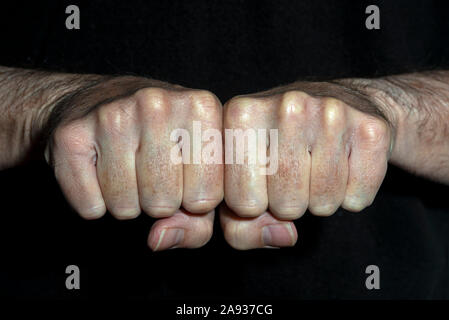 man's clenched fists side by side, close up. Stock Photo