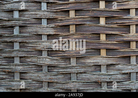 woven wooden fence, texture. Stock Photo