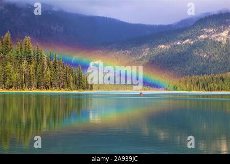 Boat on Emerald Lake under Rainbow in Yoho Nationalpark, Canada Stock Photo