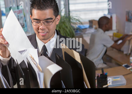 Two men with Autism working in an office Stock Photo