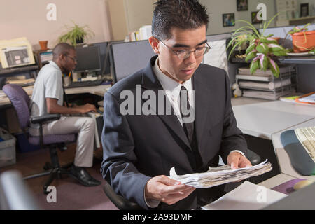 Two men with Autism working in an office Stock Photo