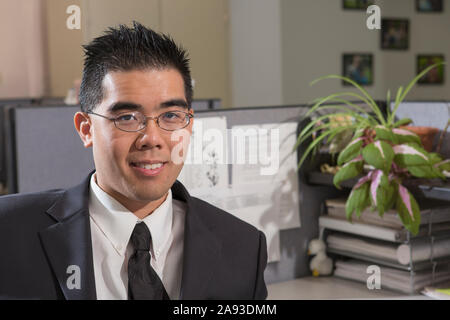 Portrait of Asian man with Autism working in an office Stock Photo