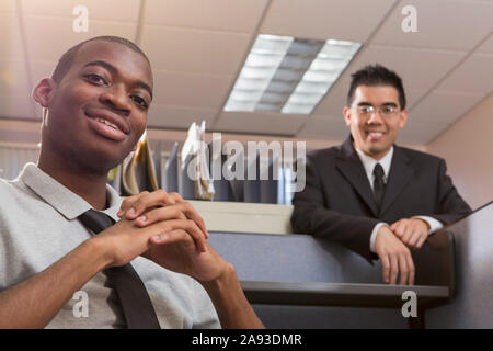 Portrait of two men with Autism smiling in an office Stock Photo