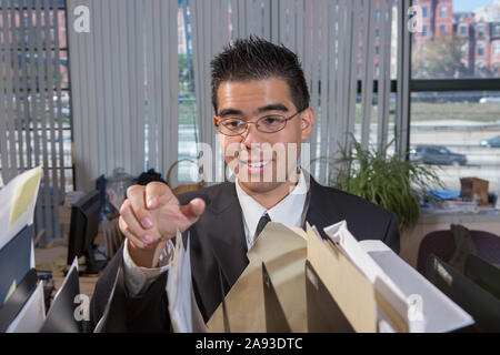 Asian man with Autism working in an office Stock Photo