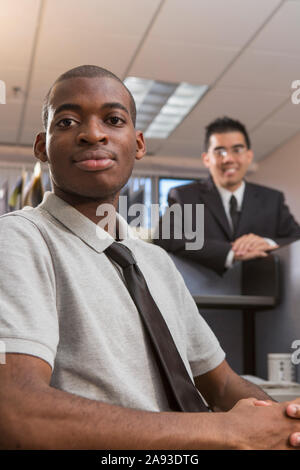 Portrait of two men with Autism working in an office Stock Photo