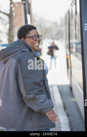 1703031170.jpg Woman with bipolar disorder smoking a cigarette at bus stop Woman, Bipolar, Smoking, Cigarette, Happiness, Disabled, Disability, Sch... Stock Photo