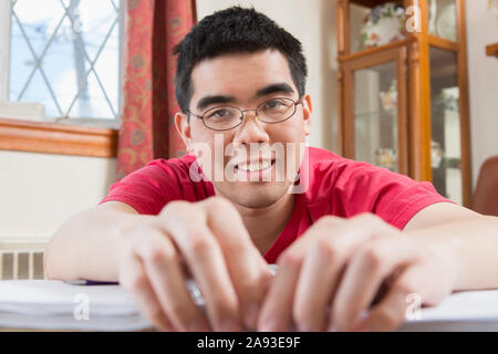 Portrait of happy Asian man with Autism working in his home Stock Photo