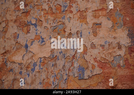 Layers of paint crumbling away from a wall making interesting texture Stock Photo