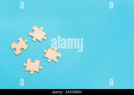 Wooden Jigsaw Puzzle On A Blue Background Stock Photo